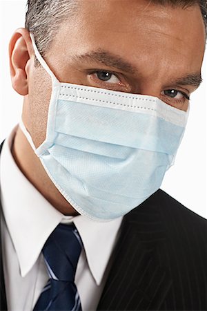 simsearch:700-01014988,k - Businessman with Surgical Mask Foto de stock - Con derechos protegidos, Código: 700-01015011