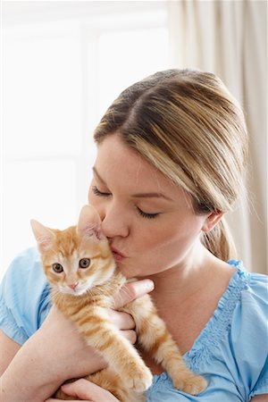 Woman Kissing Kitten Stock Photo - Rights-Managed, Code: 700-01015037