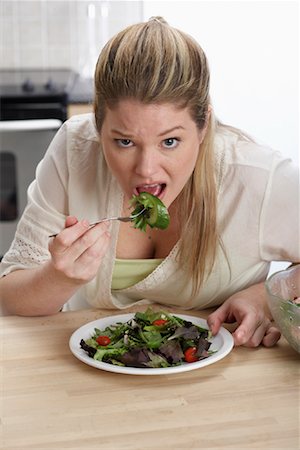 fat people eating at home - Woman Eating Salad Stock Photo - Rights-Managed, Code: 700-01015031