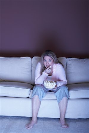 fat women eating food - Woman with Popcorn Watching Television Stock Photo - Rights-Managed, Code: 700-01015054