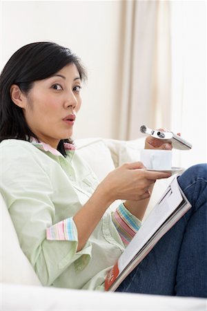 Woman Caught Spiking her Coffee Stock Photo - Rights-Managed, Code: 700-01029687