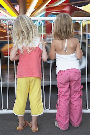 Girls Watching Amusement Park Ride Stock Photo - Rights-Managed, Code: 700-01030088