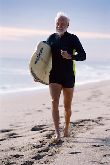 Man Running with Surfboard Foto de stock - Derechos protegidos Premium, Artista: George Shelley, Código de la imagen: 700-01030226