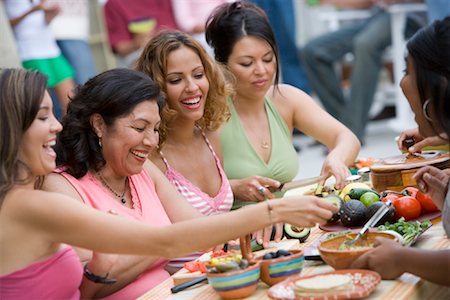 Women Preparing Food at Family Gathering Stock Photo - Rights-Managed, Code: 700-01041268