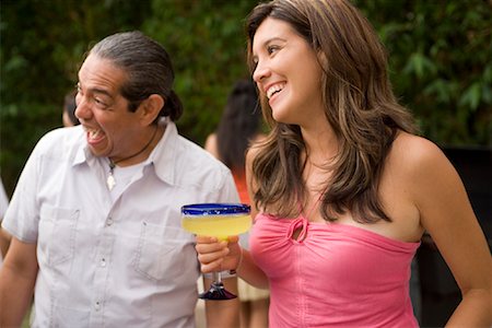 summer backyard party - Man and Woman at Family Gathering Foto de stock - Con derechos protegidos, Código: 700-01041295