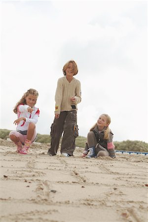 Children Playing Hopscotch on Beach Fotografie stock - Rights-Managed, Codice: 700-01042694