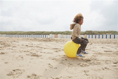 Boy Bouncing on Space Hopper Stock Photo - Rights-Managed, Code: 700-01042706