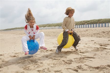 simsearch:695-03385268,k - Children Bouncing on Space Hoppers Stock Photo - Rights-Managed, Code: 700-01042707