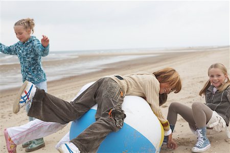 profile of boy jumping - Children Playing with Large Beach Ball Stock Photo - Rights-Managed, Code: 700-01042716