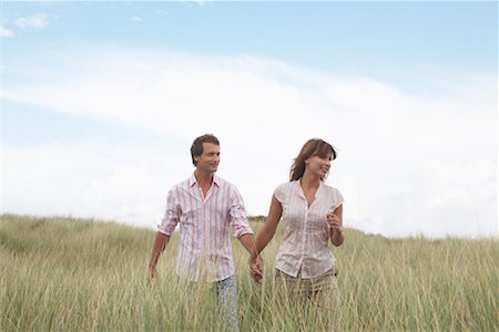 simsearch:700-01042800,k - Couple Walking Through Field of Long Grass Stock Photo - Rights-Managed, Code: 700-01042767