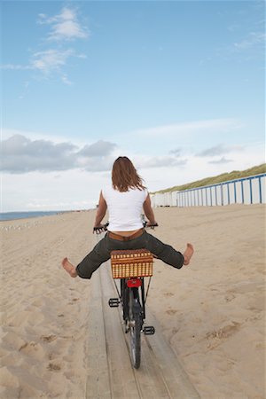 Woman Riding Bicycle on Beach Stock Photo - Rights-Managed, Code: 700-01042784