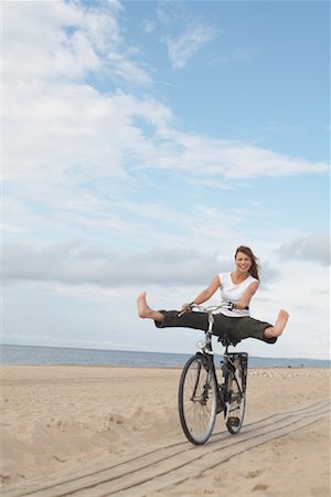 Woman Riding Bicycle on Beach Stock Photo - Rights-Managed, Code: 700-01042780