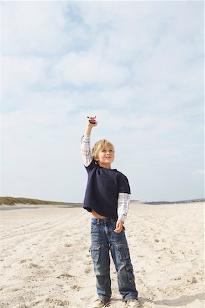 Boy Flying Kite at Beach Stock Photo - Rights-Managed, Code: 700-01042810