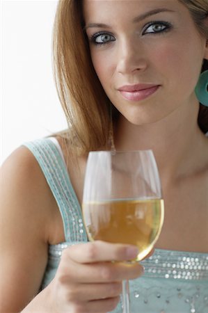 simsearch:700-03553391,k - Portrait of Woman Holding Glass of White Wine Stock Photo - Rights-Managed, Code: 700-01043107