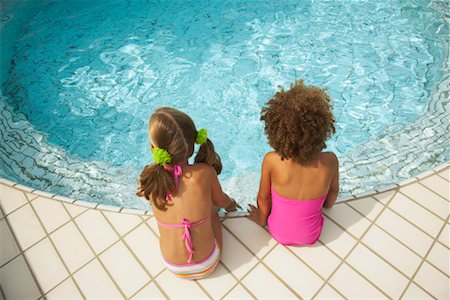 Girls Sitting on Pool Side Stock Photo - Rights-Managed, Code: 700-01072122