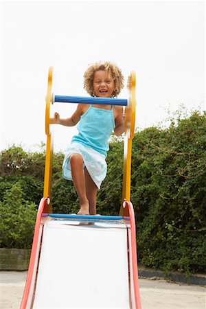 Girl Standing on Slide Stock Photo - Rights-Managed, Code: 700-01072179