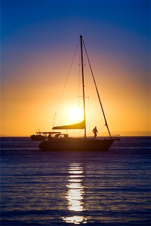 Voilier au coucher du soleil, Moreton Island, Queensland, Australie Photographie de stock - Rights-Managed, Code: 700-01072485