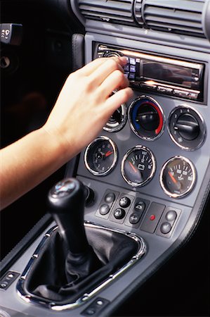 Woman Adjusting Car Radio Stock Photo - Rights-Managed, Code: 700-01073037