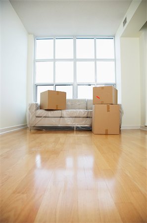 Sofa and Boxes in Living Room of New Condo Stock Photo - Rights-Managed, Code: 700-01073431