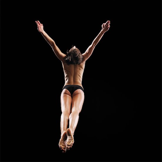 Woman Jumping in Air Stock Photo - Premium Rights-Managed, Artist: Brian Kuhlmann, Image code: 700-01083155