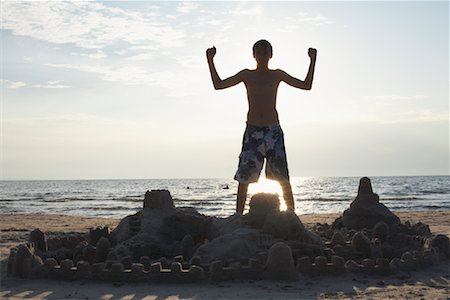 flexing kids - Boy with Sandcastle Stock Photo - Rights-Managed, Code: 700-01083600