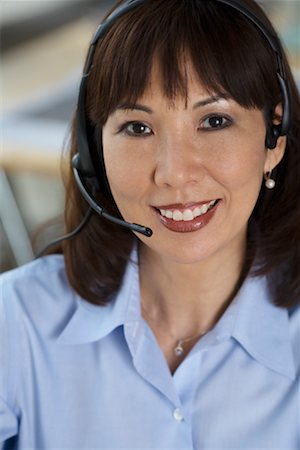 Businesswoman Wearing Headset Foto de stock - Con derechos protegidos, Código: 700-01099752