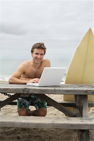 Man Using Laptop at Beach Stock Photo - Rights-Managed, Code: 700-01099791