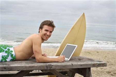 Man Using Laptop at Beach Stock Photo - Rights-Managed, Code: 700-01099792