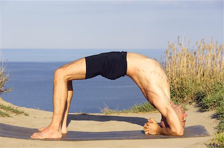 posición de rueda - Man Practicing Yoga Foto de stock - Con derechos protegidos, Código: 700-01109745