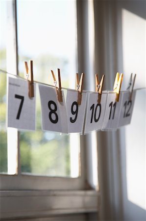 Numbers Hanging on Line in Classroom Fotografie stock - Rights-Managed, Codice: 700-01119720