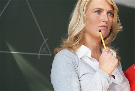 Teacher Standing in front of Blackboard, Thinking Stock Photo - Rights-Managed, Code: 700-01119744