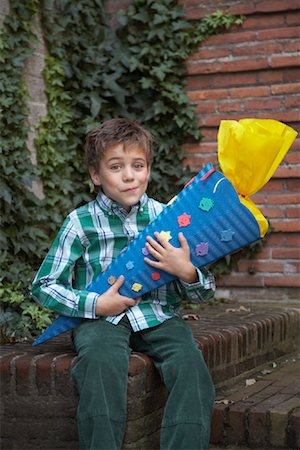 school cone - Portrait of Boy Holding Gift Stock Photo - Rights-Managed, Code: 700-01119775