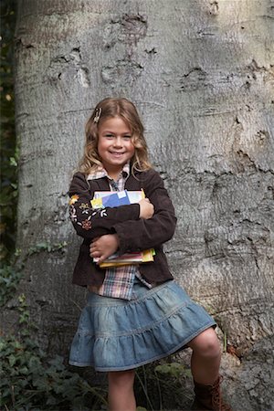 Portrait of Girl Holding Books Stock Photo - Rights-Managed, Code: 700-01119772