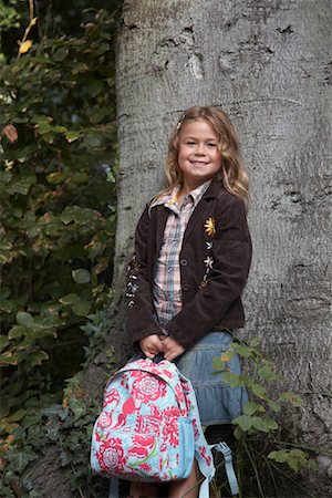 Portrait of Girl Holding Backpack Stock Photo - Rights-Managed, Code: 700-01119773