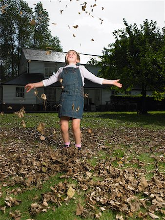 Girl Playing in Leaves Stock Photo - Rights-Managed, Code: 700-01119823