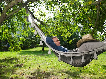 sleeping backyard - Man Sleeping in Hammock Stock Photo - Rights-Managed, Code: 700-01119838