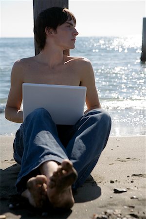 Man Using Laptop at Beach Stock Photo - Rights-Managed, Code: 700-01110138