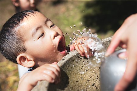 drink flowing - Boy at Water Fountain Stock Photo - Rights-Managed, Code: 700-01110609