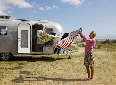 retro women camping - Woman Hanging Laundry on Clothesline Stock Photo - Rights-Managed, Code: 700-01111474