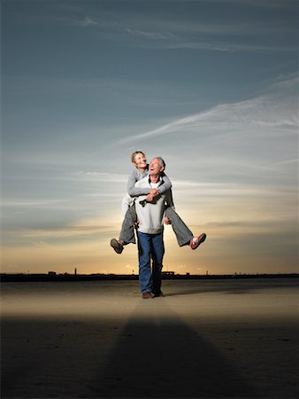 Man Giving Woman a Piggyback Ride Stock Photo - Rights-Managed, Code: 700-01111523