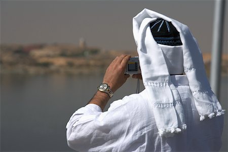 Man Taking Photograph at Aswan Dam, Aswan, Egypt Stock Photo - Rights-Managed, Code: 700-01124788