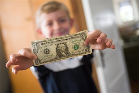 Boy Holding Dollar Bill Stock Photo - Rights-Managed, Code: 700-01120594