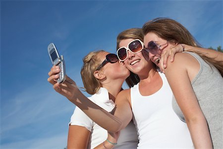 Girls Taking Picture with Cell Phone Stock Photo - Rights-Managed, Code: 700-01123517