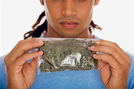 Homme tenant le sac de Marijuana Photographie de stock - Rights-Managed, Code: 700-01164959