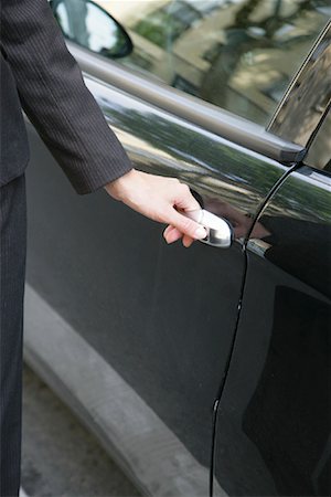 Woman Opening Car Door Stock Photo - Rights-Managed, Code: 700-01165059