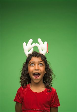 simsearch:700-00984296,k - Portrait of Girl Wearing Reindeer Antlers Stock Photo - Rights-Managed, Code: 700-01163895