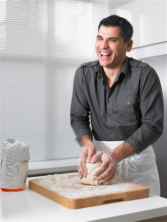 Man Kneading Dough Stock Photo - Rights-Managed, Code: 700-01174084