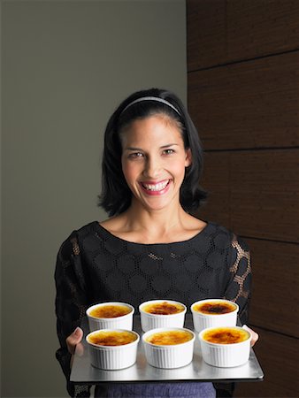 Woman Holding Creme Brulee Servings Stock Photo - Rights-Managed, Code: 700-01174098