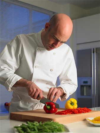 Chef Slicing Peppers Stock Photo - Rights-Managed, Code: 700-01174110