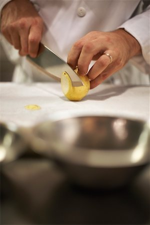 slicing fruit - Chef Slicing Nashi Stock Photo - Rights-Managed, Code: 700-01172138